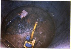 View down shaft at Coombs site. Two diggers are now involved due to the limestone layer.